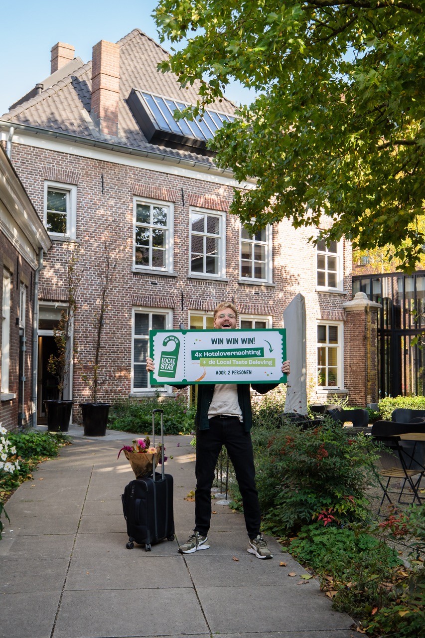 person standing with large voucher