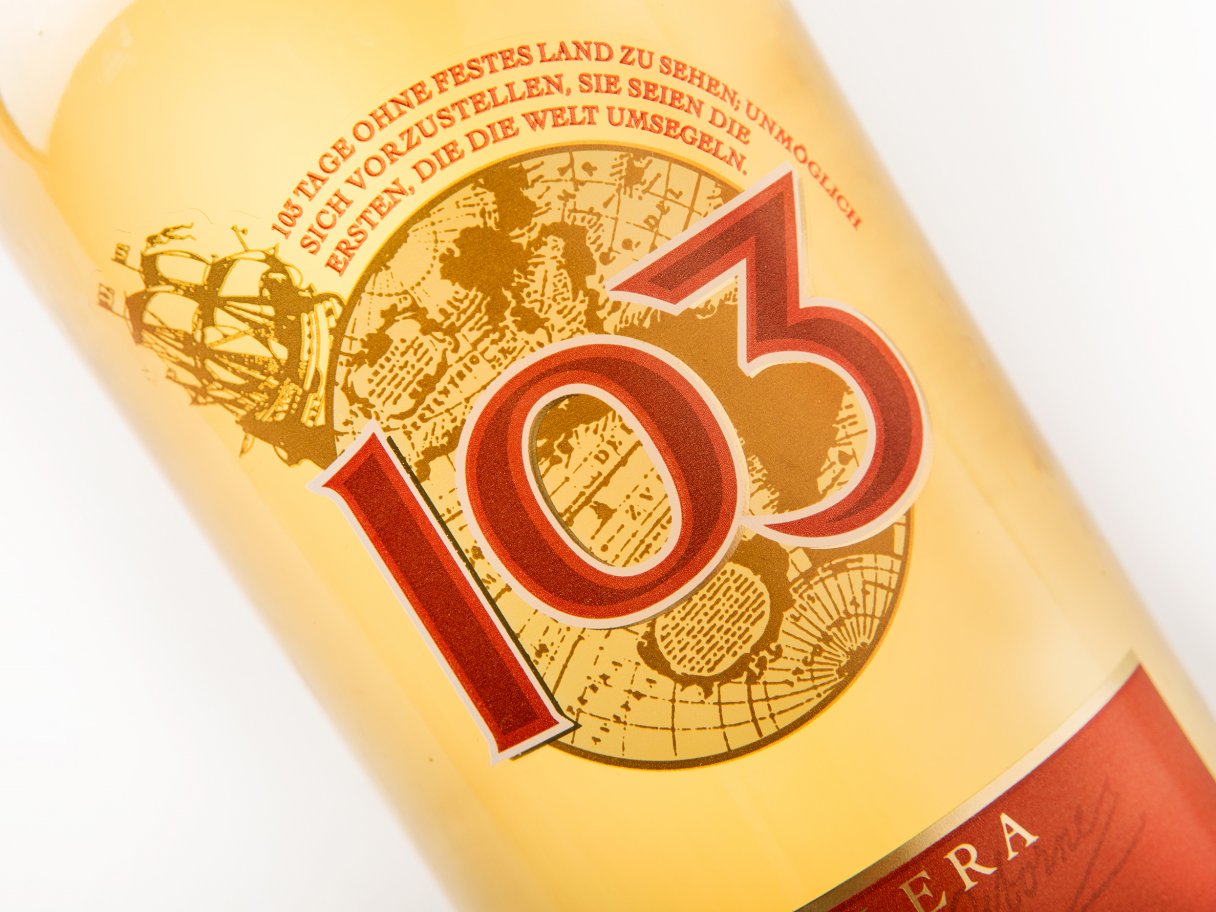 Rooftops of a coastal town with the sea in background