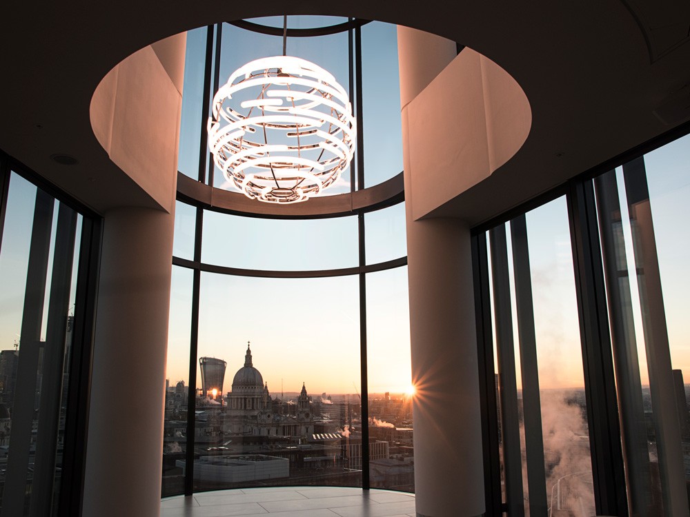 Deloitte Orb – large suspended light with curved opal acrylic and chrome finish