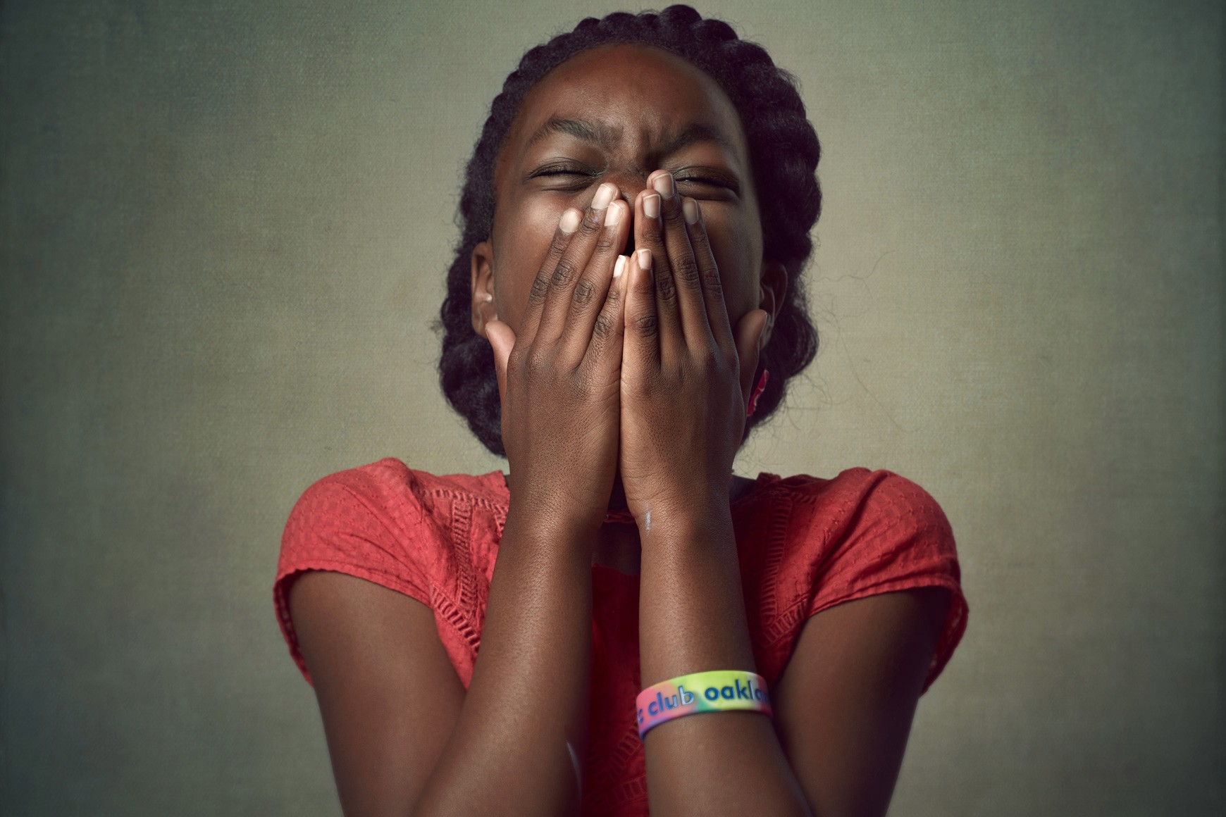 Joyful editorial portrait of a young girl laughing, capturing authentic emotion and character. Casting and lifestyle photography for diverse campaigns in the Bay Area.