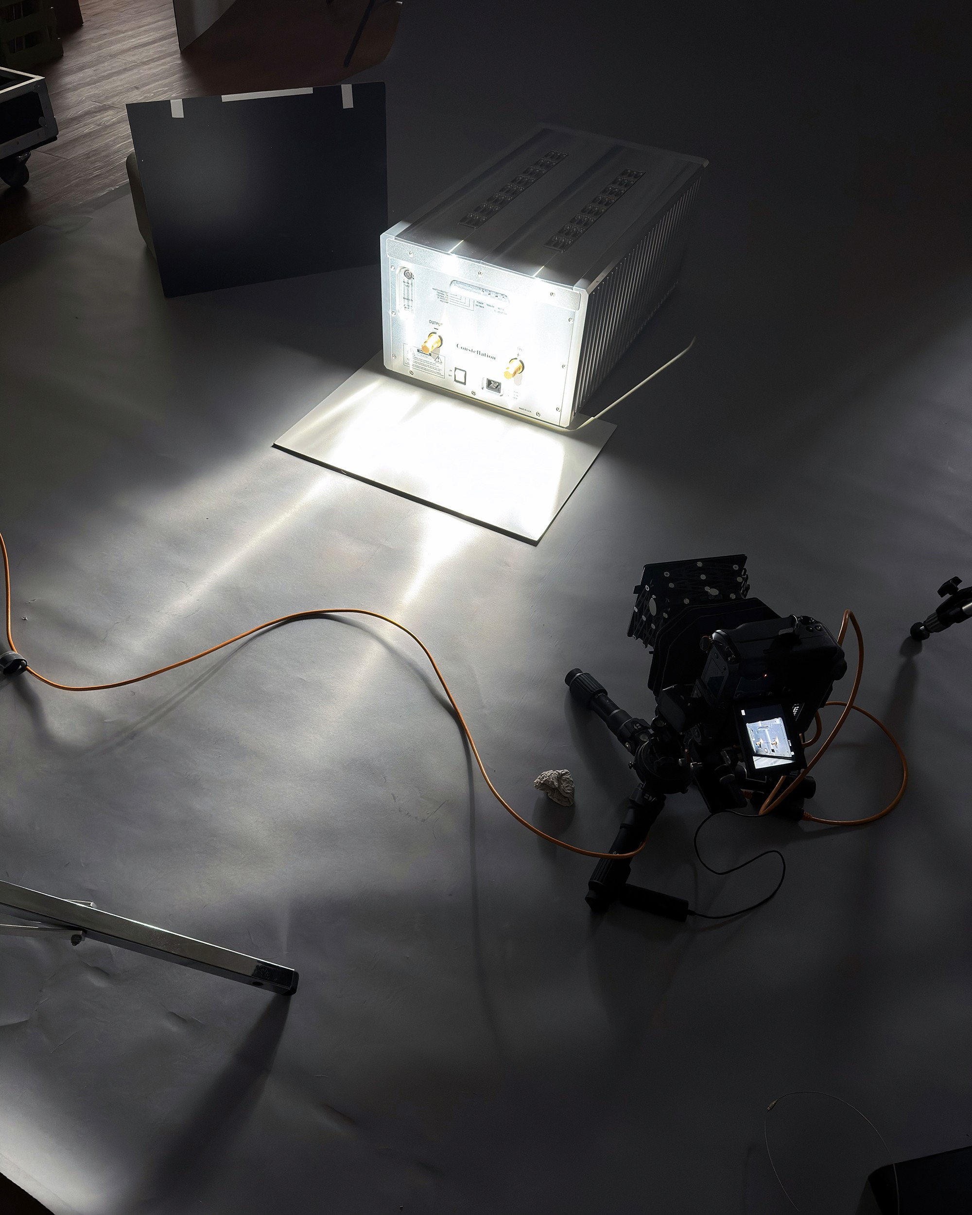 A behind the scenes photo from a product photoshoot by October Custom Publishing for The Absolute Sound magazine