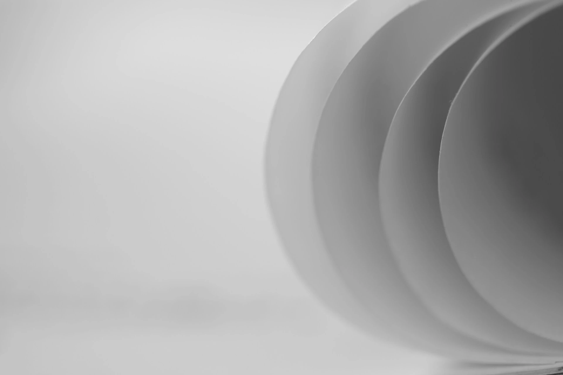 a black and white photo of a white wall