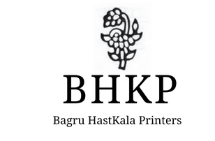 Modern home office setup with a monitor, ergonomic chair, keyboard, and indoor plants near a window with blinds.