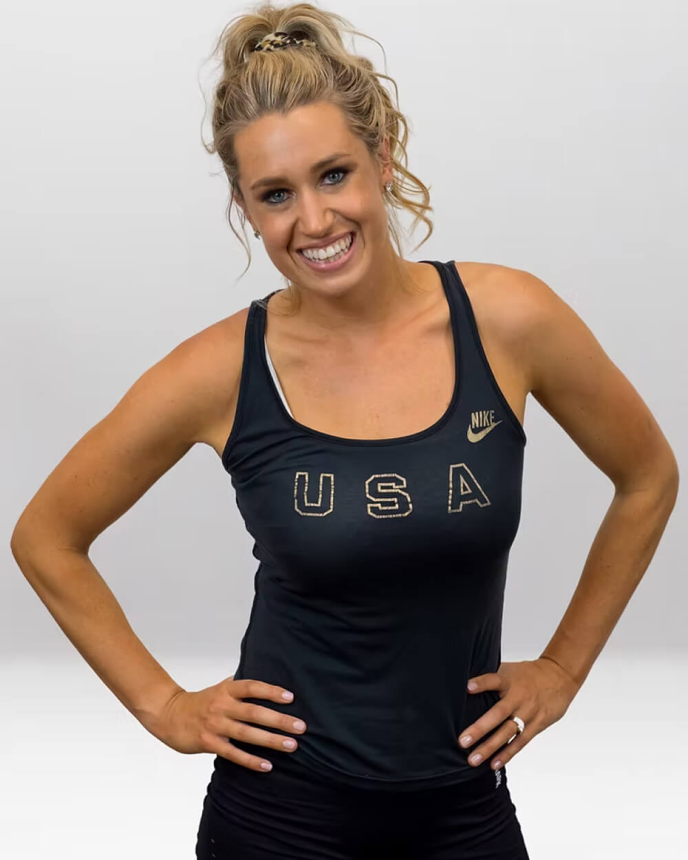 Katie collecting a blood sample from her upper arm at home.