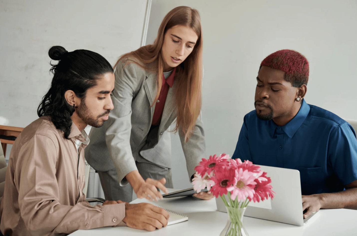 A cozy scene with warm sunlight casting stripes, featuring a potted plant and soft towels on a window sill.