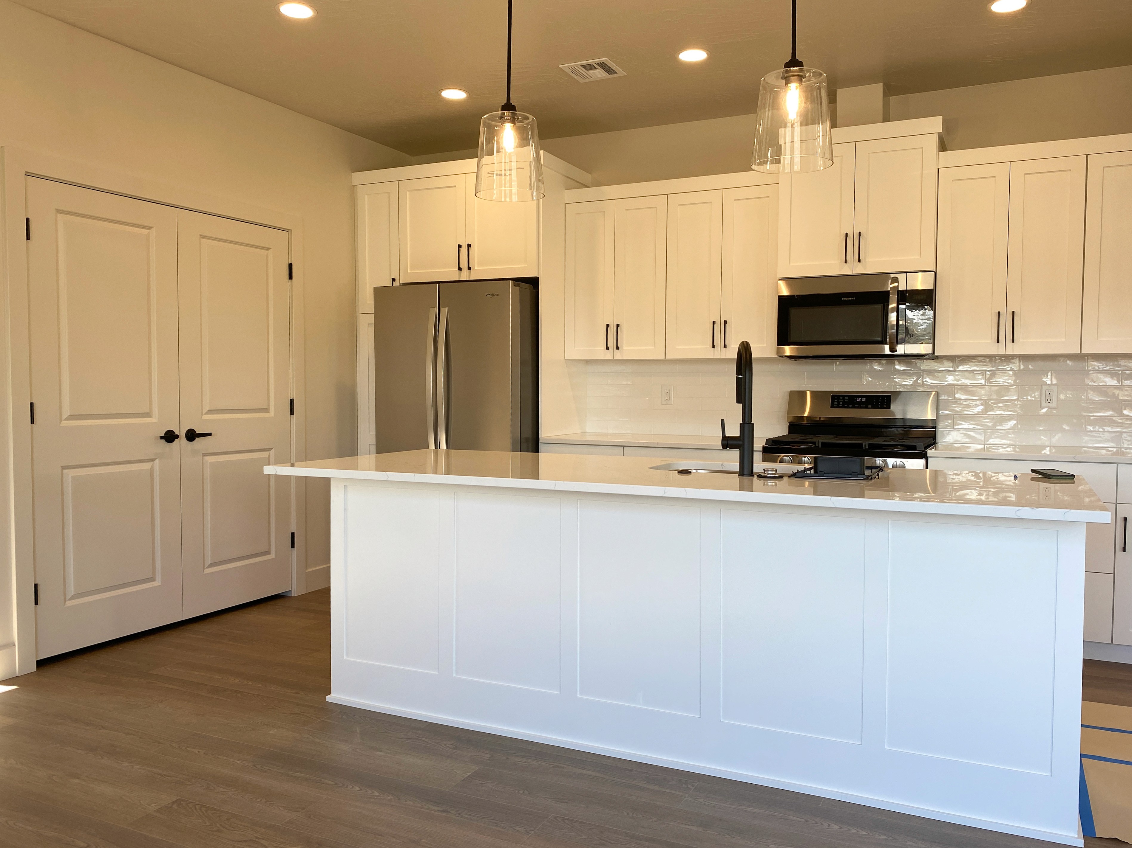 Open kitchen in a Hurricane, Utah duplex connecting to living space.