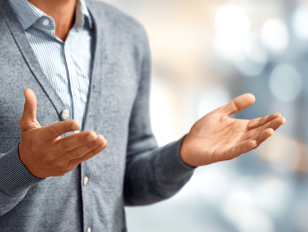 Profile portrait of a man in a white shirt against a light background
