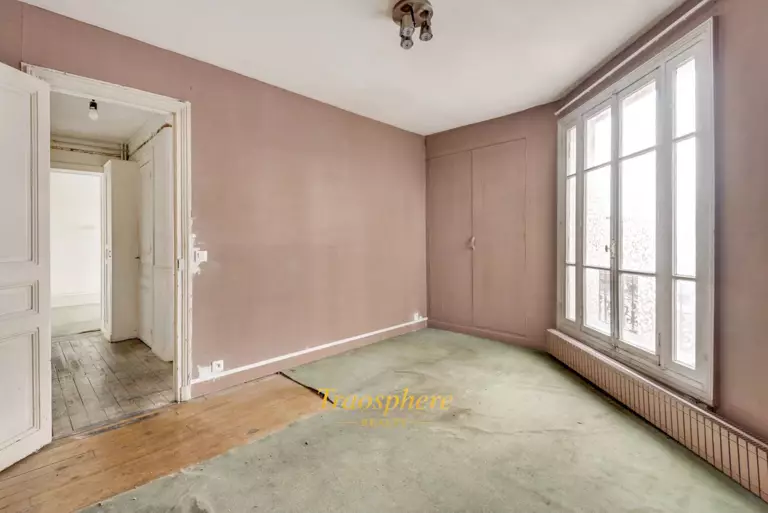 A serene backyard with a pool, sun loungers, and olive trees, set against a warm, sunny landscape.