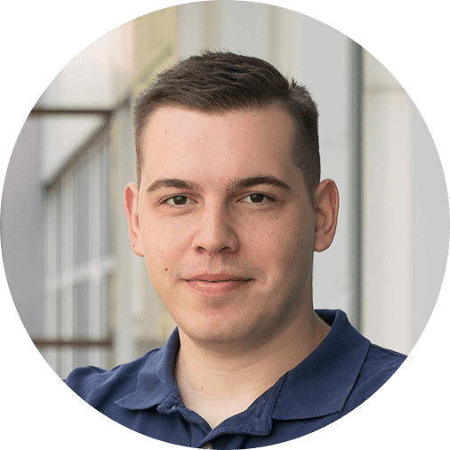Black and white portrait of a man with a beard and glasses