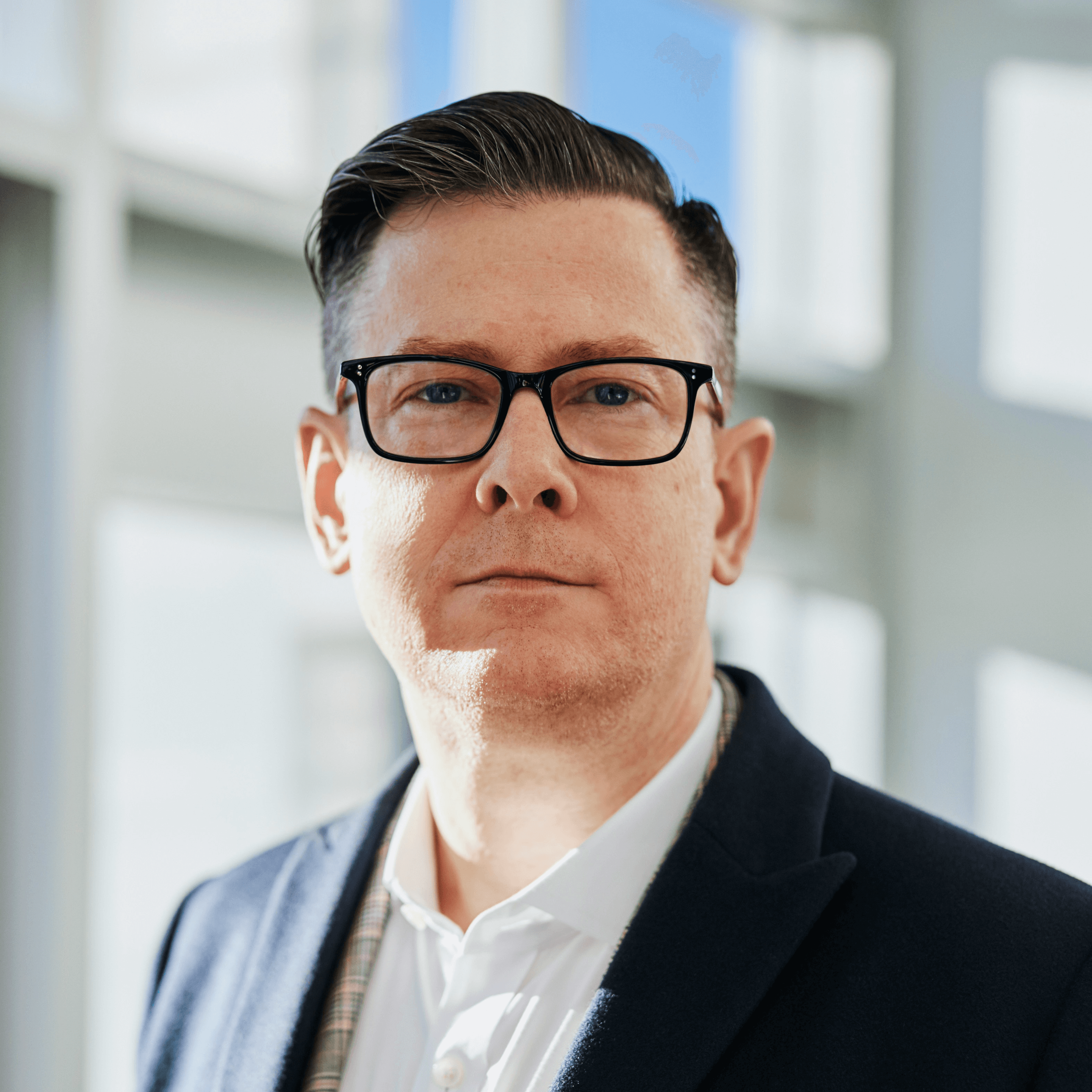 man standing beside wall