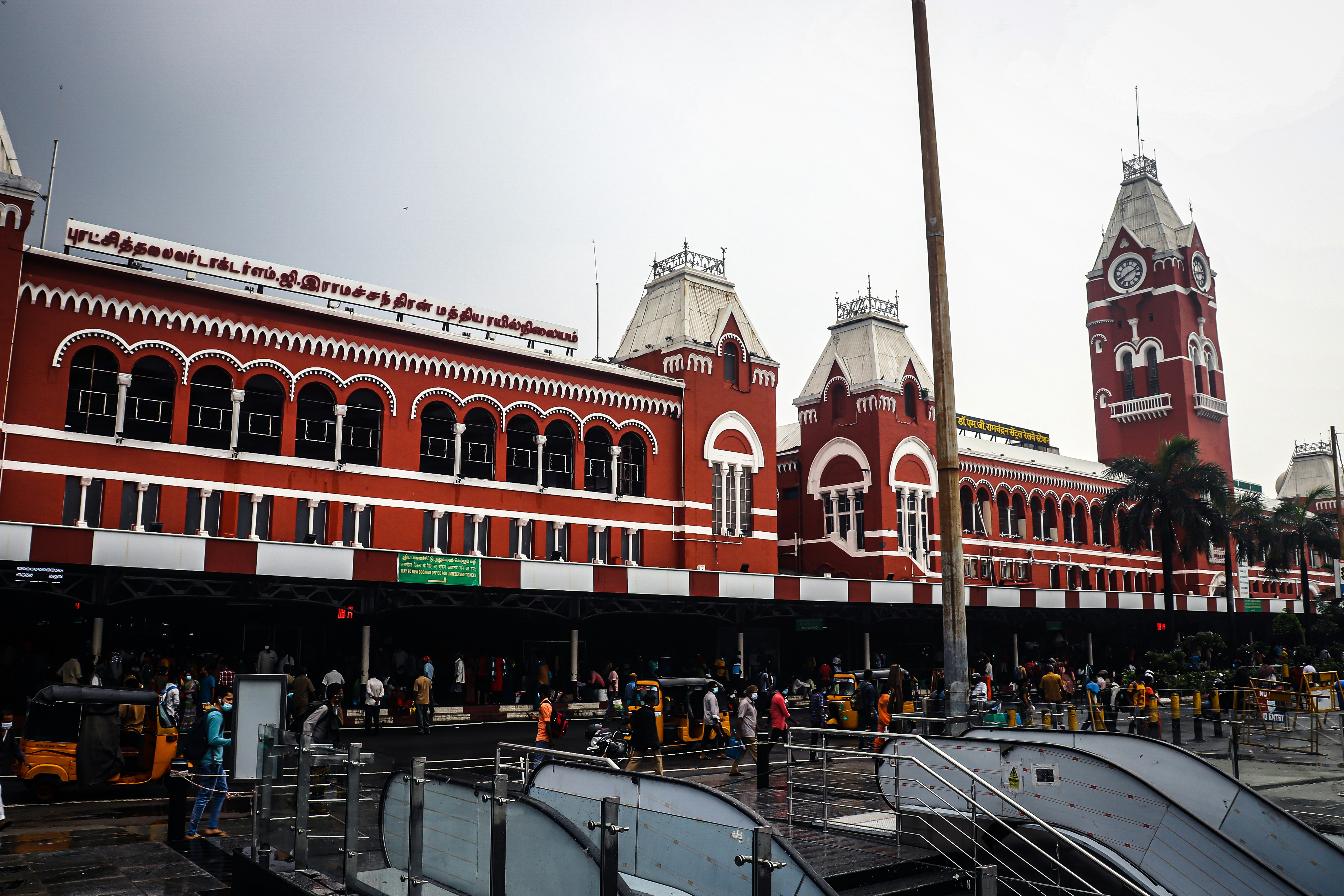 a red and white building with a clock tower