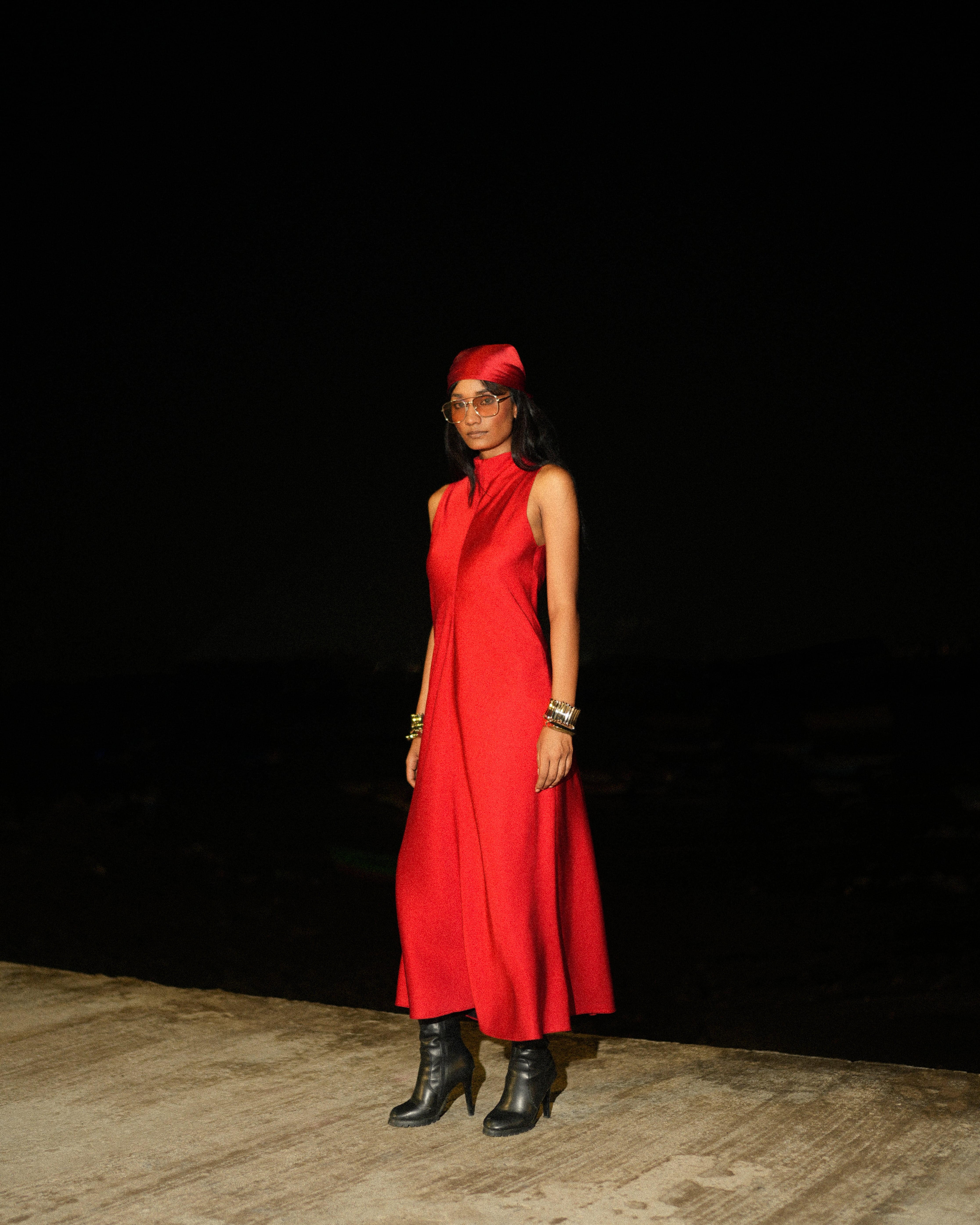 Two people talking on a rooftop at sunset