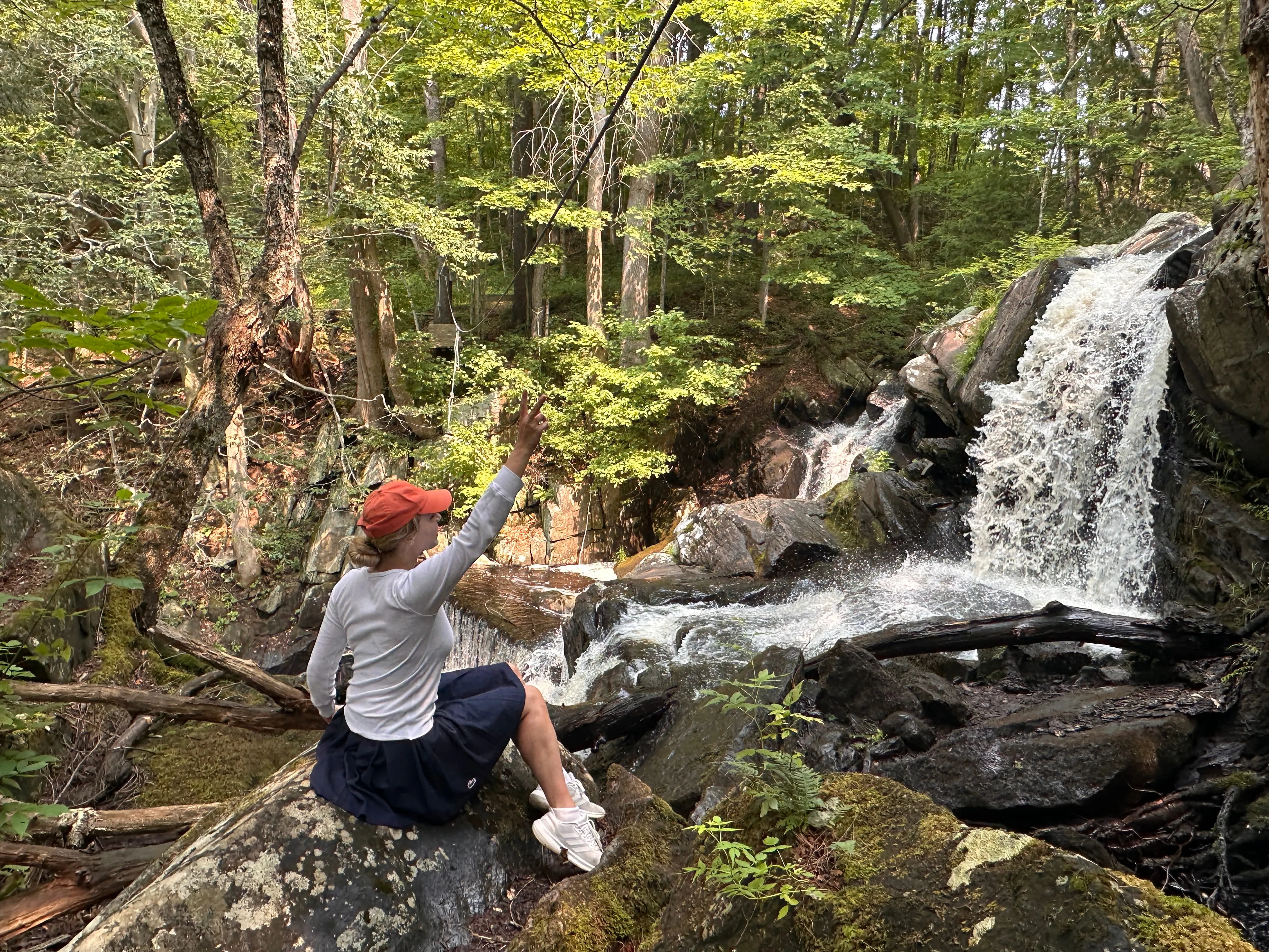 Hiker by a waterfall near Camp Lenox in the Berkshires