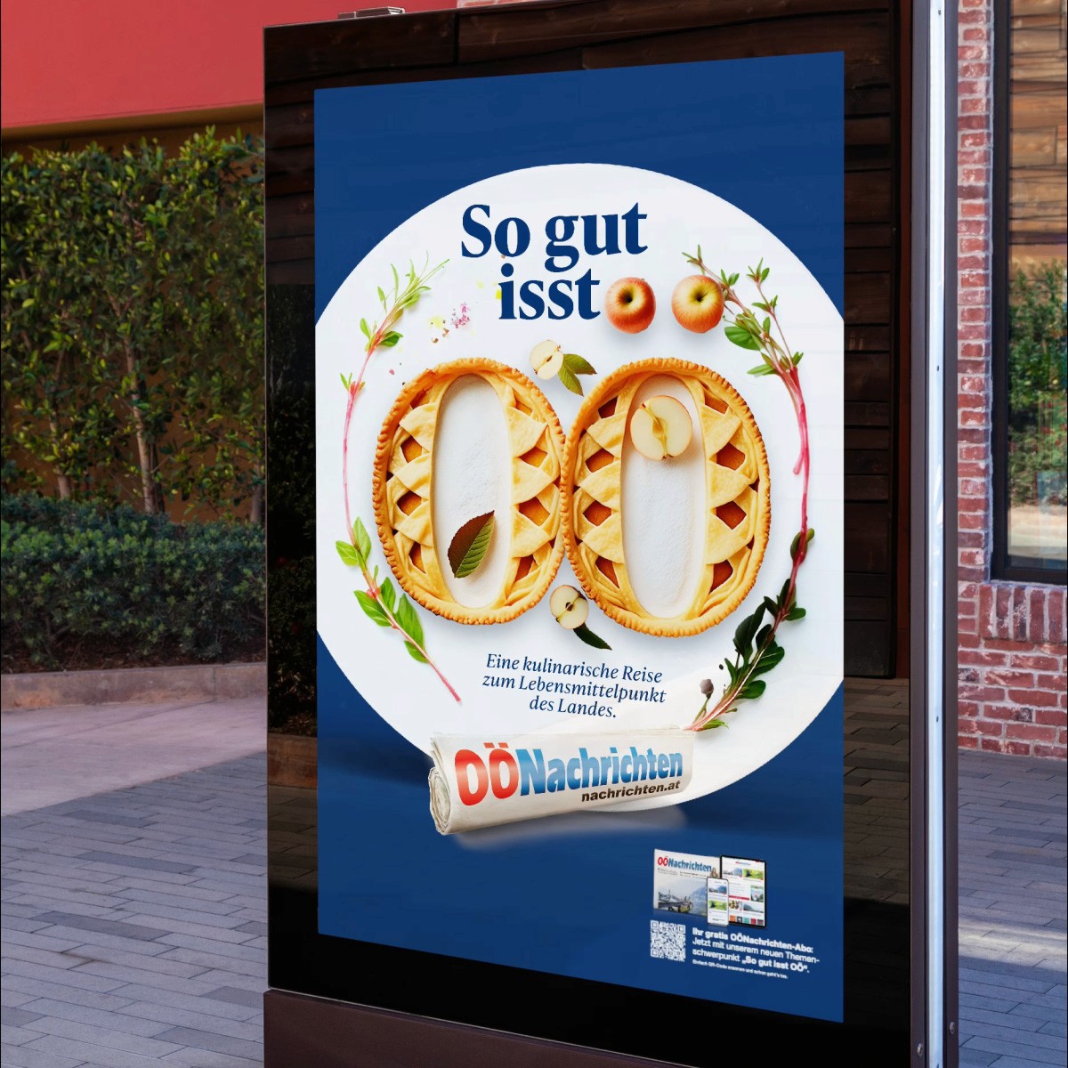 Ein Plakat zeigt das Sujet „So gut isst OÖ“ mit zwei Apfelstrudeln in Form der Buchstaben OÖ und dem Hinweis auf die kulinarische Reihe der OÖNachrichten.