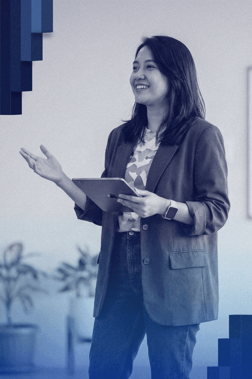 woman sitting around table holding tablet