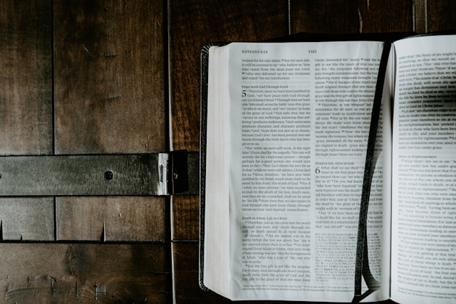 open Bible on wooden background