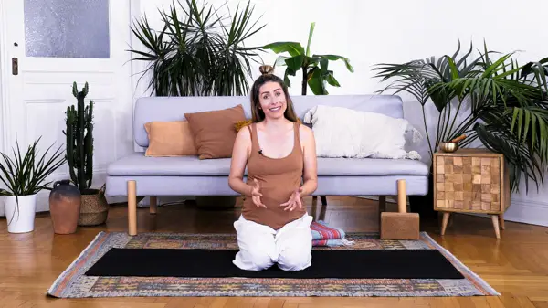 Pregnant woman in a grounded seated meditation pose – Day 9 prenatal yoga with gentle movement and affirmations to build body acceptance during pregnancy