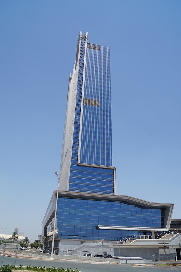 Street view of the modern Control Tower skyscraper. Contact our real estate agents for available business listings.