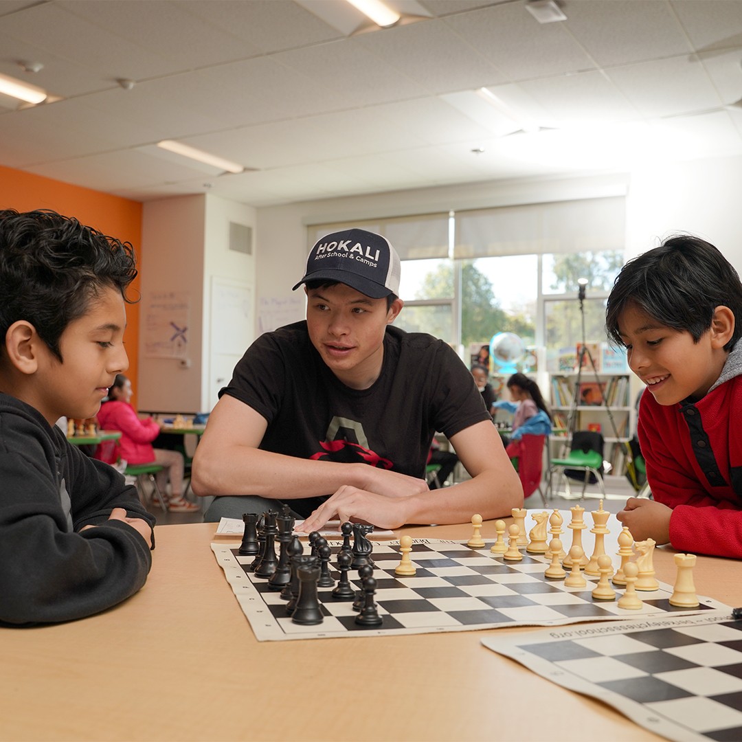 students learning strategy and critical thinking during a chess enrichment class with a HOKALI instructor
