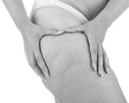 a woman sitting on a chair with her legs crossed