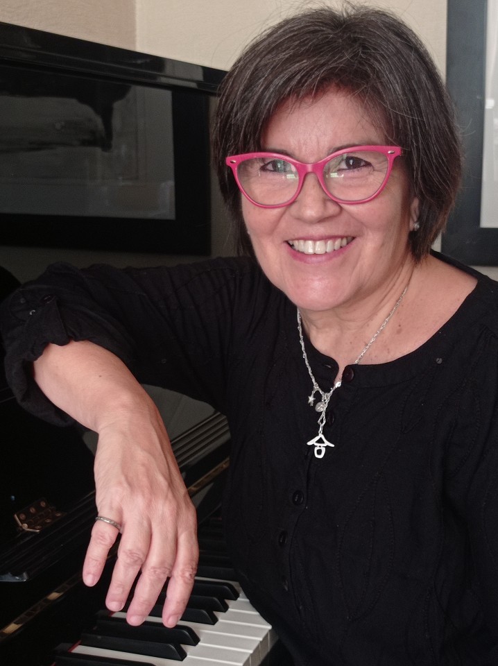 baby playing multicolored xylophone toy