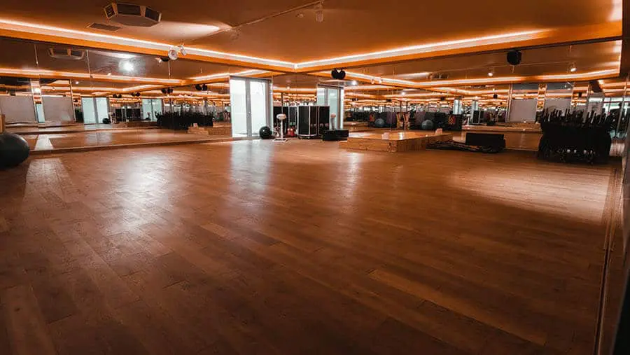 Modern house exterior with a pool and outdoor dining area.