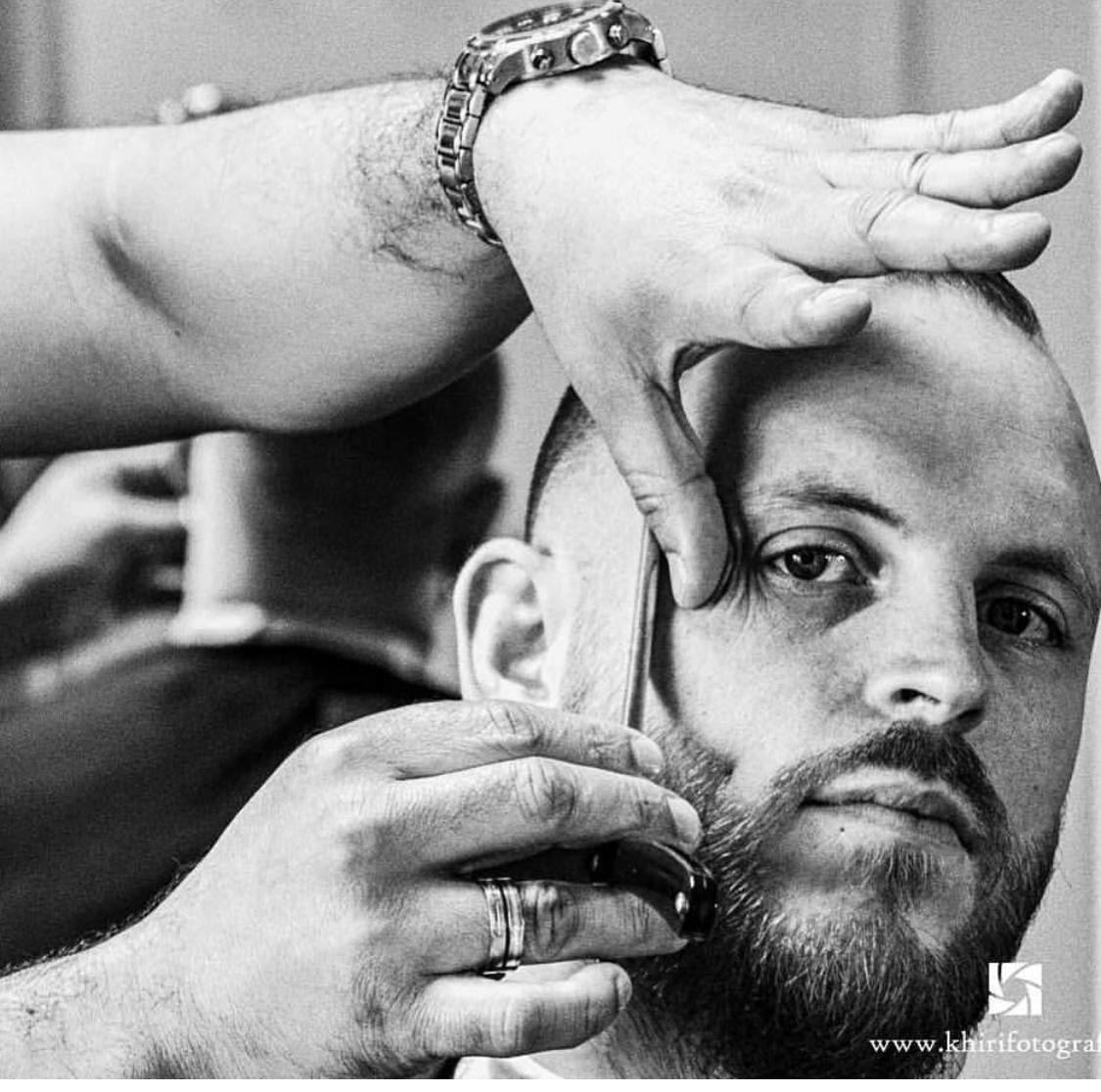 Barber attending client