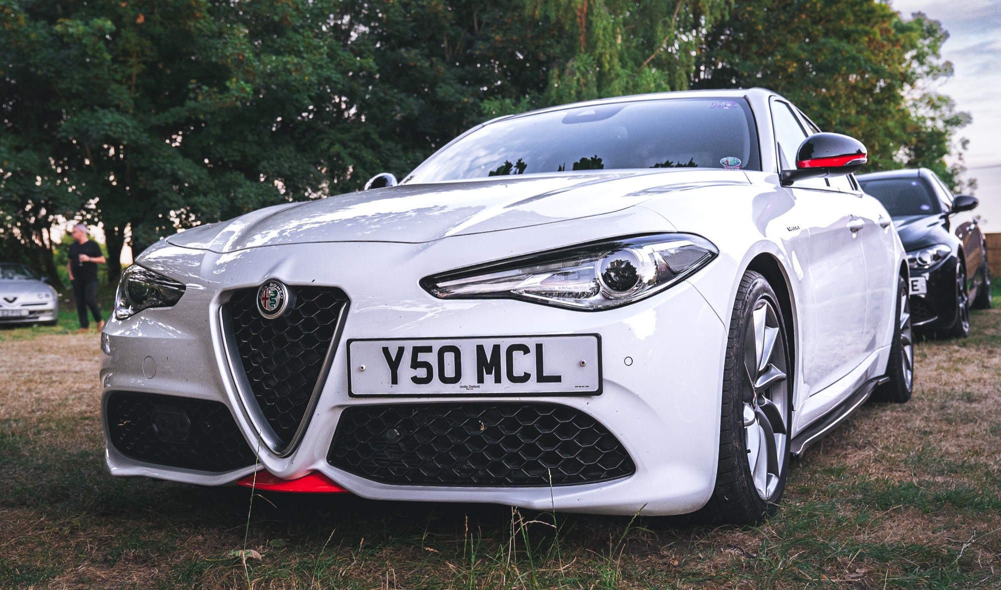 White Alfa Romeo Giulia at a car show