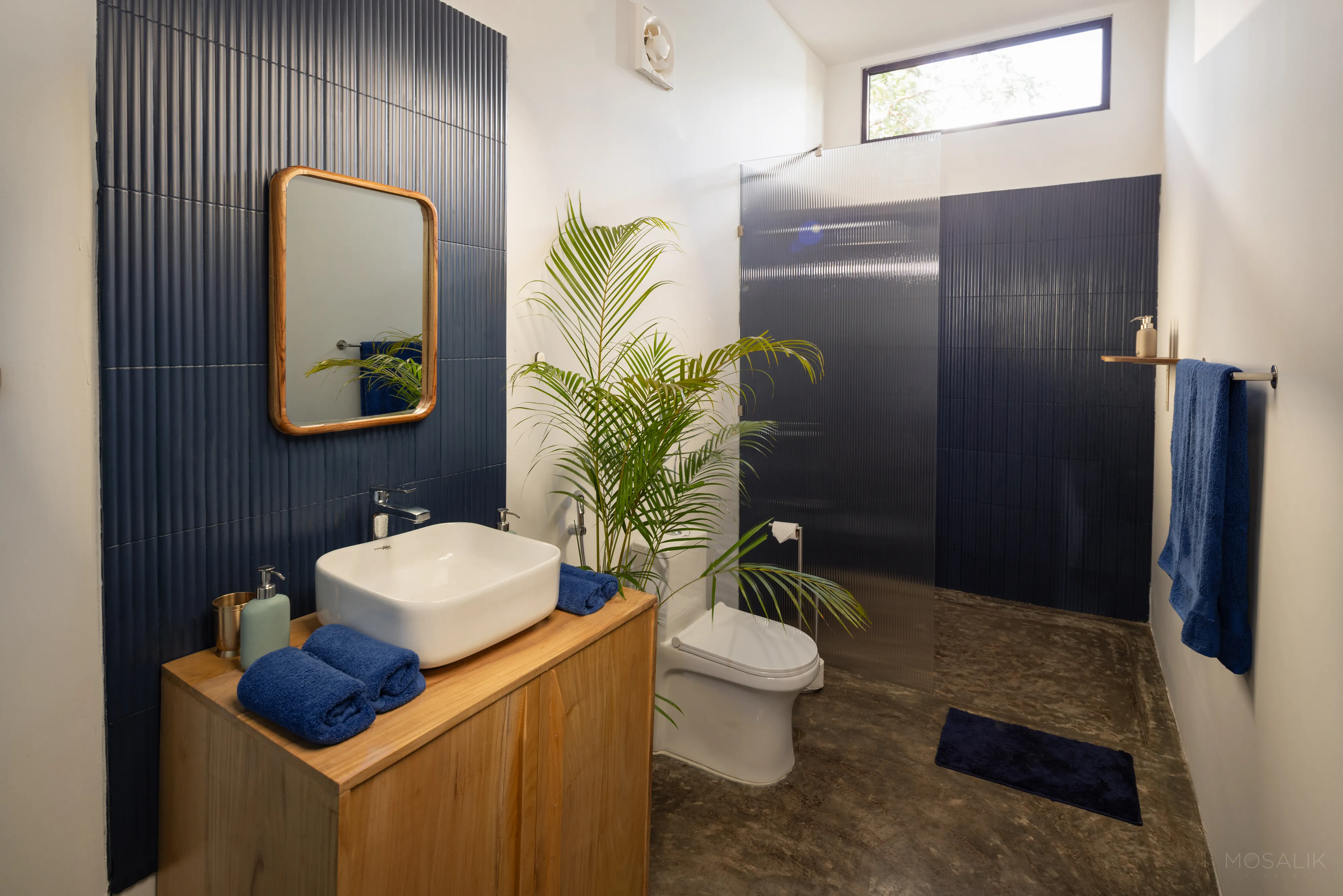 Bathroom vanity in navy and teak at Jaali Blue