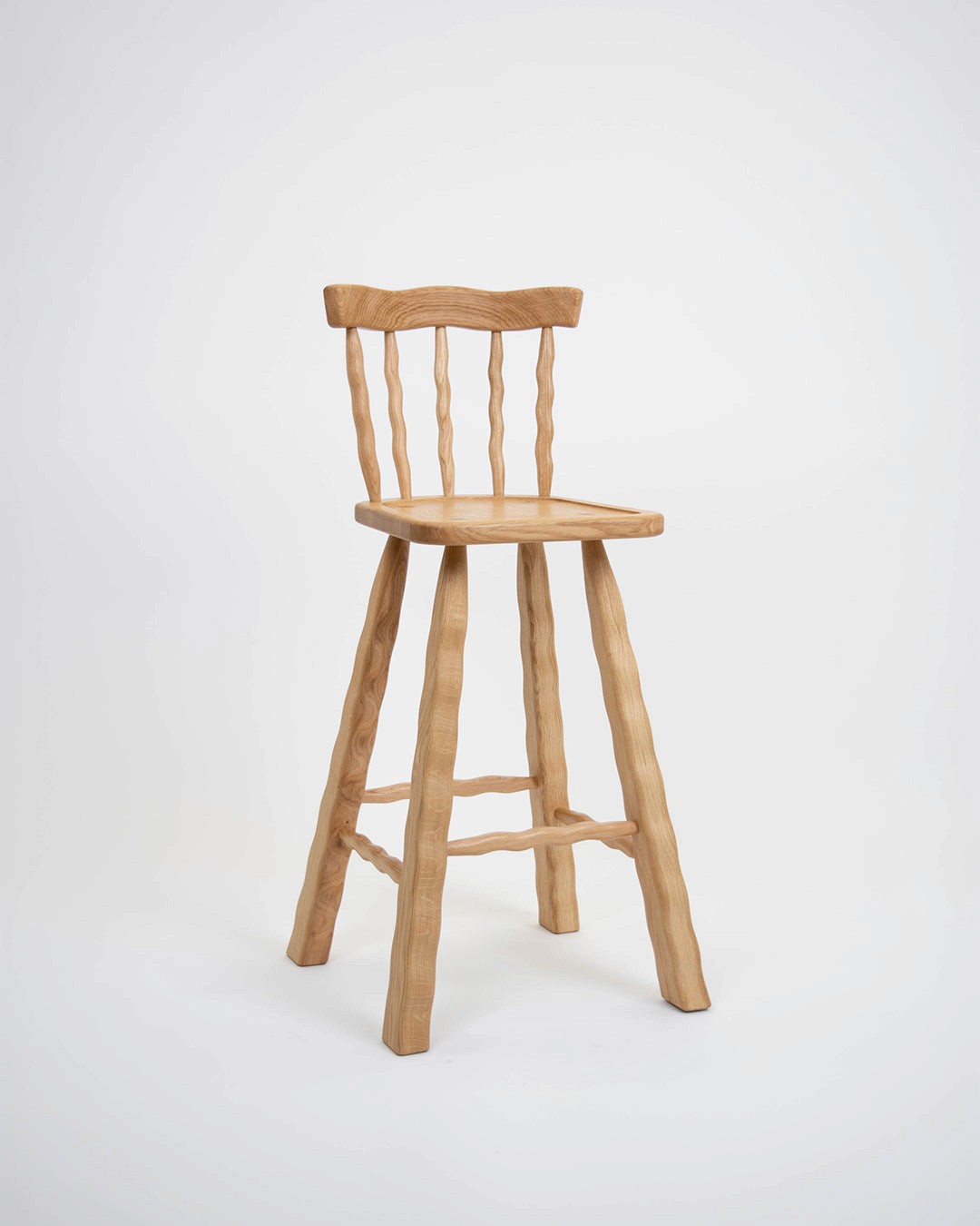 Wooden bar stool on a white background