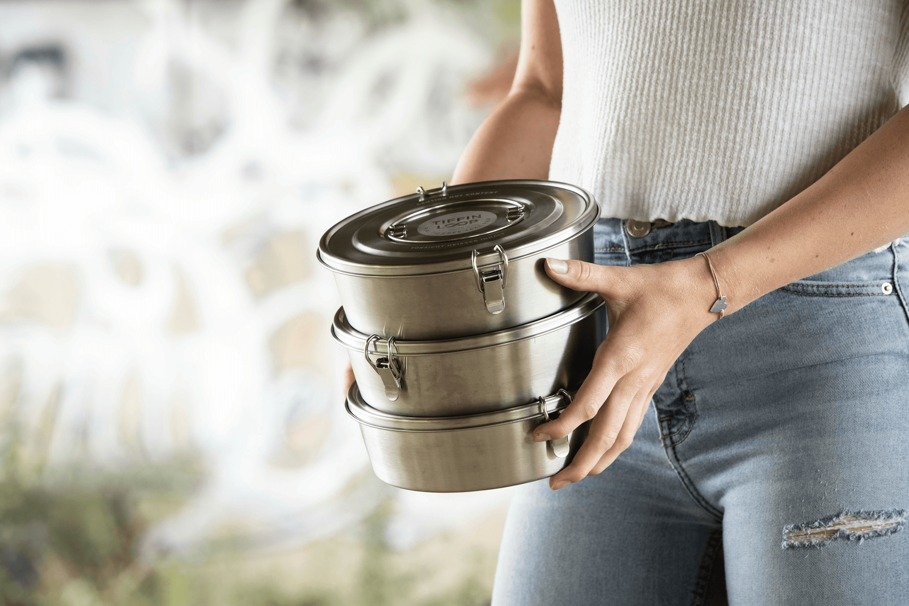 Stack of three stainless steel lunch containers