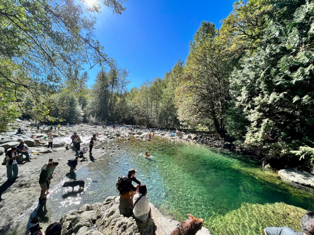 People enjoying in the shallow waters of the 30 foot pool