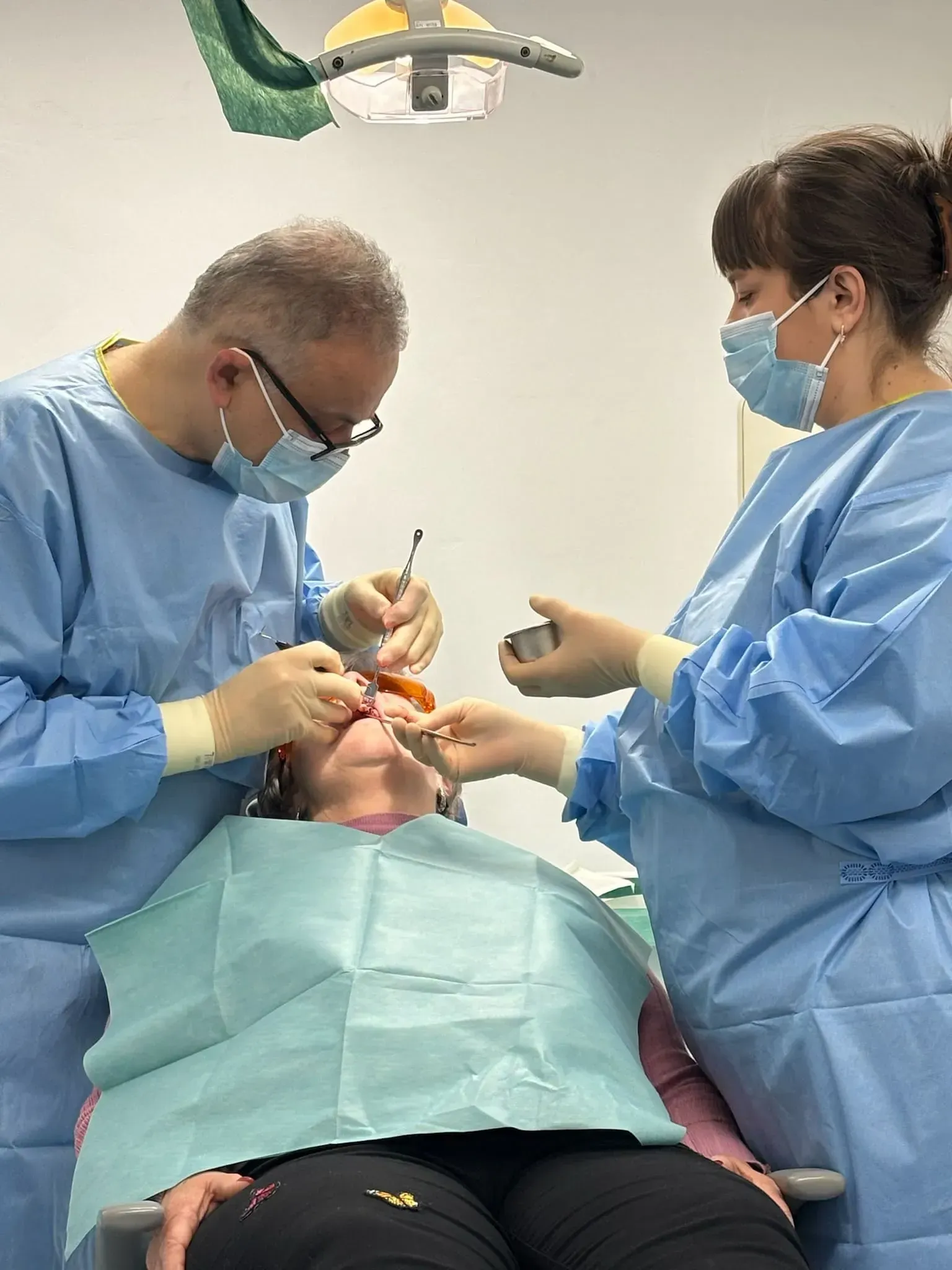 Dr Yasser and his nurse in surgery.