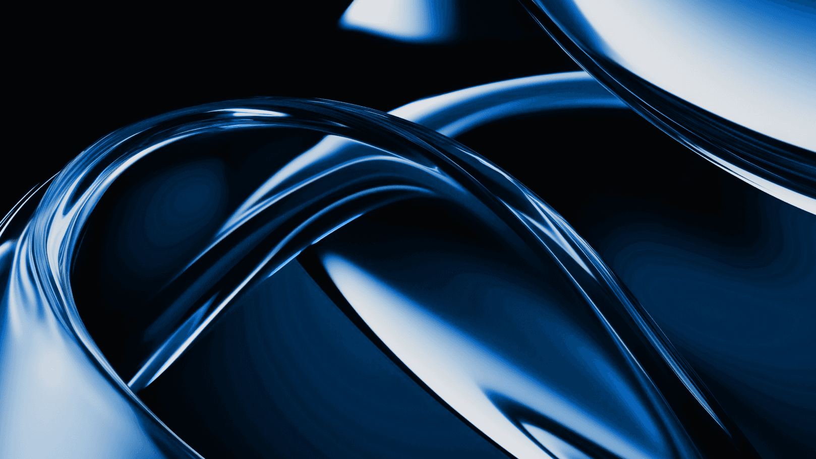 A car's headlights illuminate a winding road at night, with a vibrant sunset and distant mountains in the background.