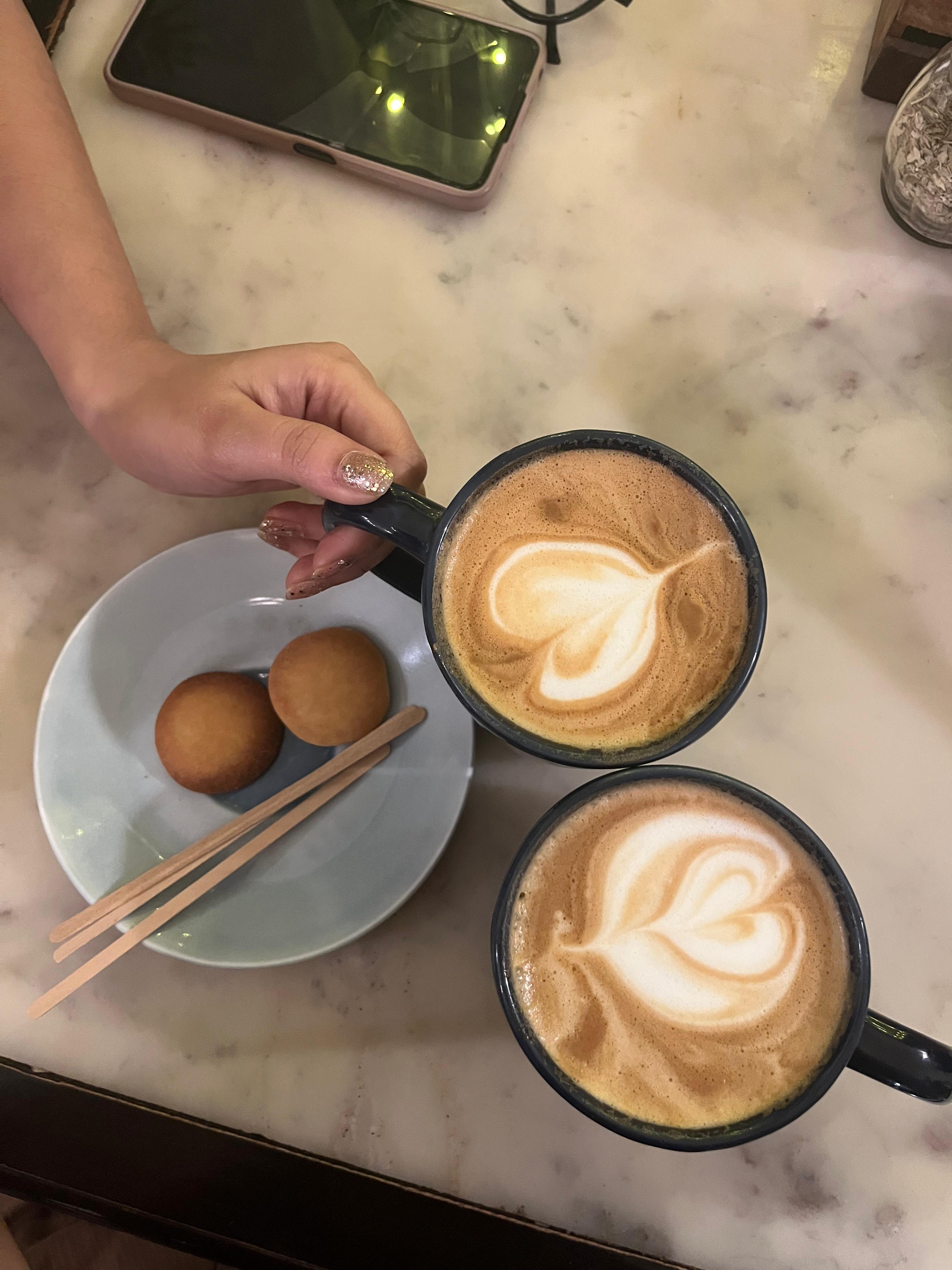 hand holding a coffee cup