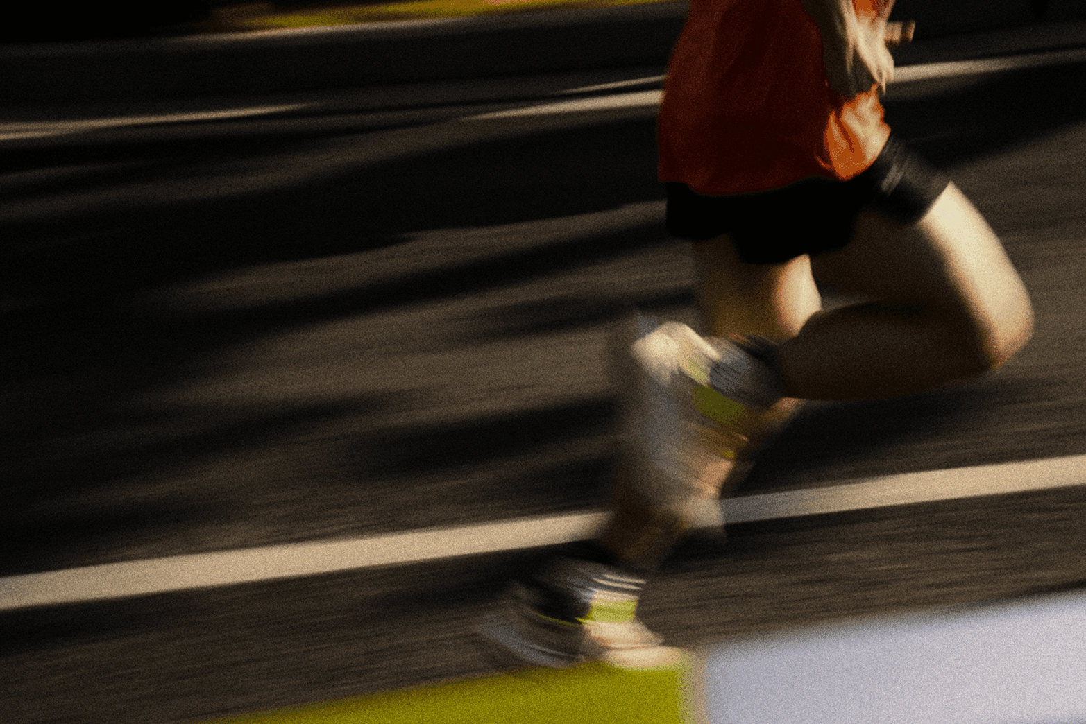 Runner in motion on a road with strong motion blur effect