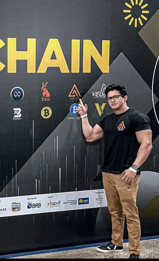 person discussing while standing in front of a large screen in front of people inside dim-lighted room