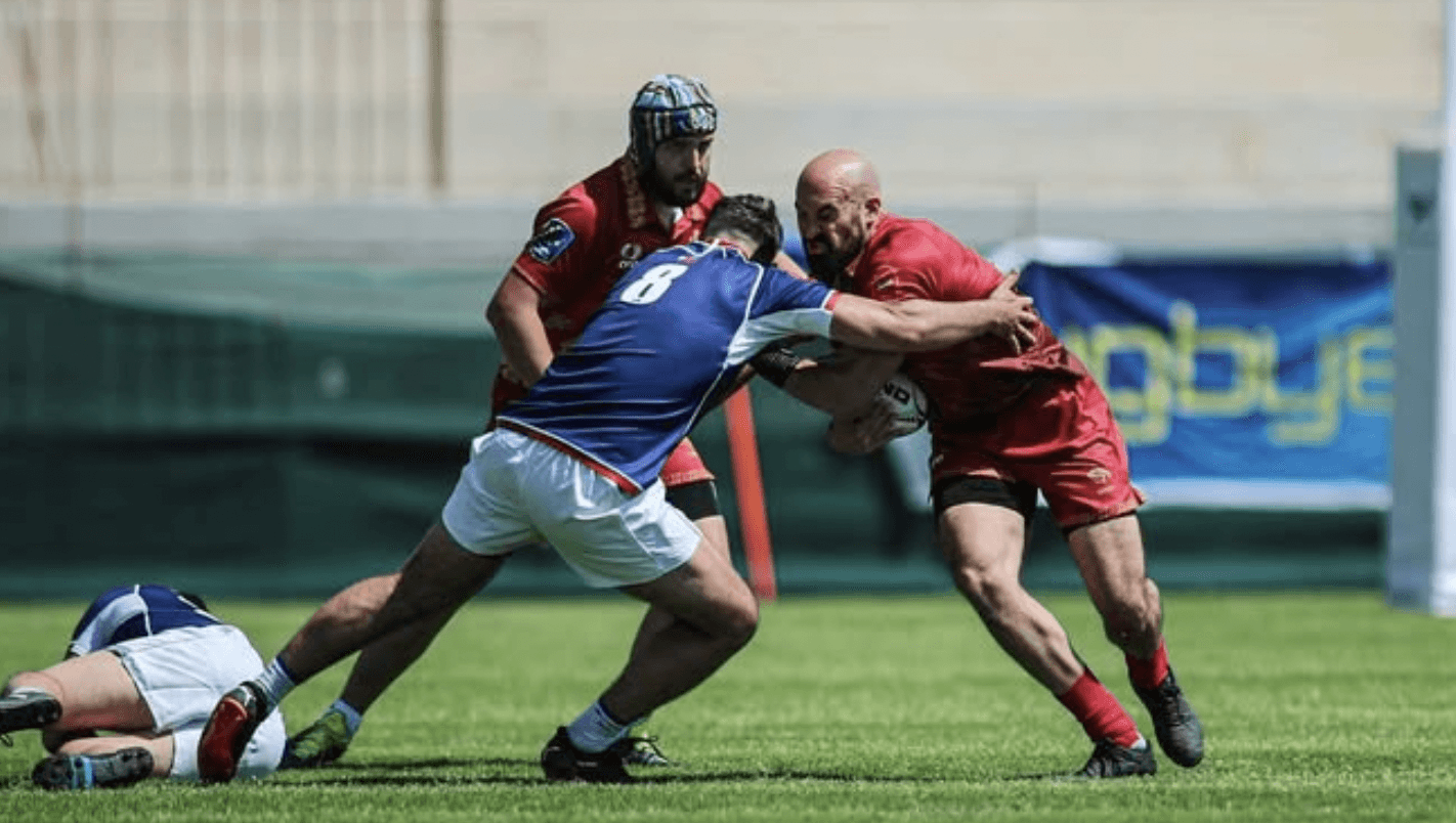 three rugby players collide