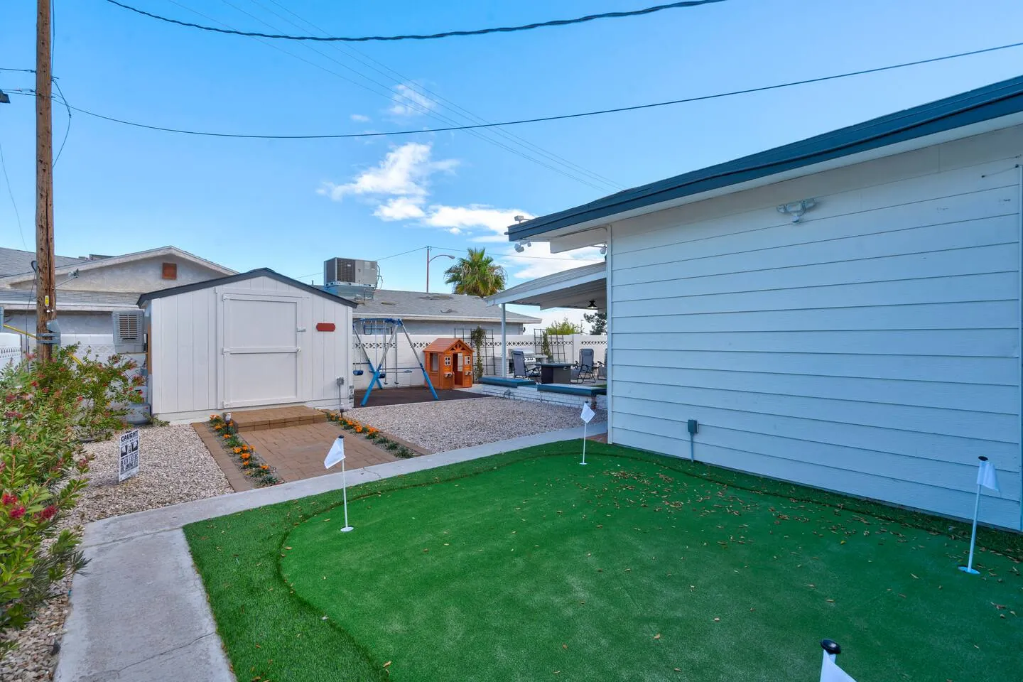 Backyard putting green beside the storage shed, Wizard’s Dream in North Las Vegas