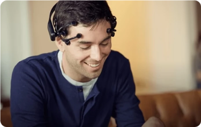 Man wearing Emotiv EEG headset