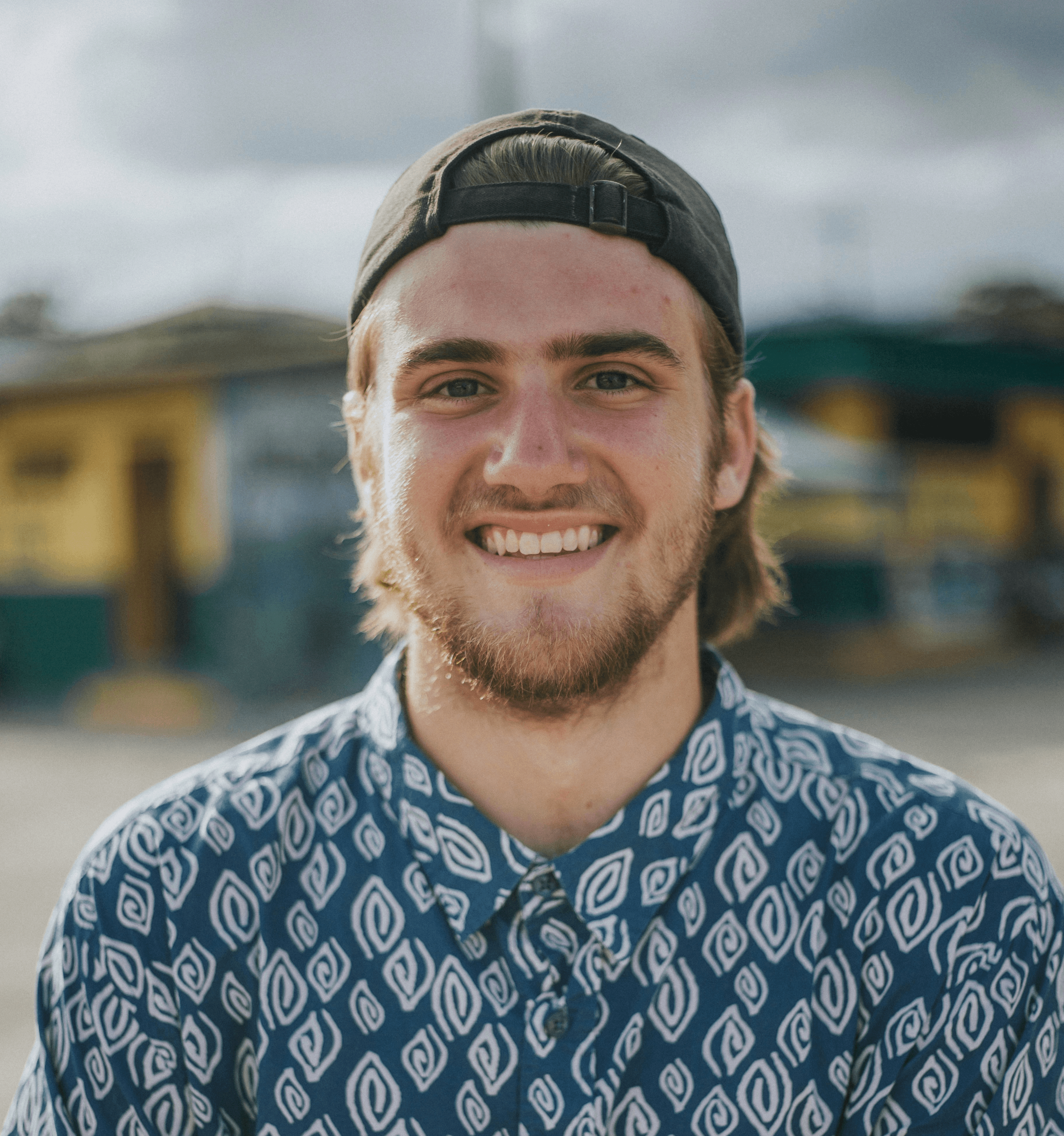 person wearing blue top smiling