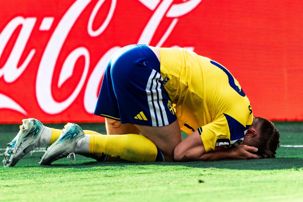 A Sweden player kneels devastated on the pitch after France's World Cup win on June 30, 2026