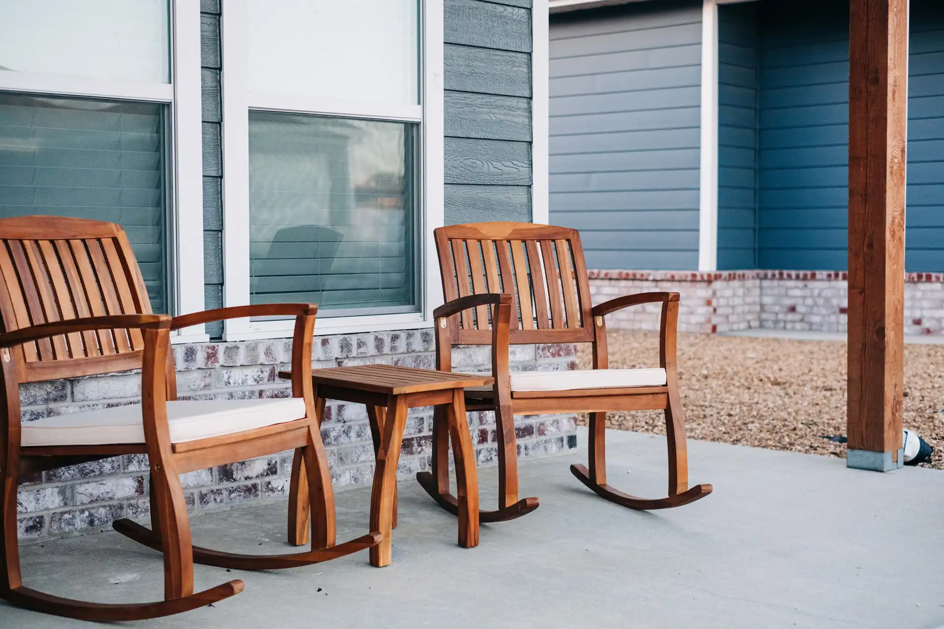Rosales Masonry brickwork with two rocking chairs on porch