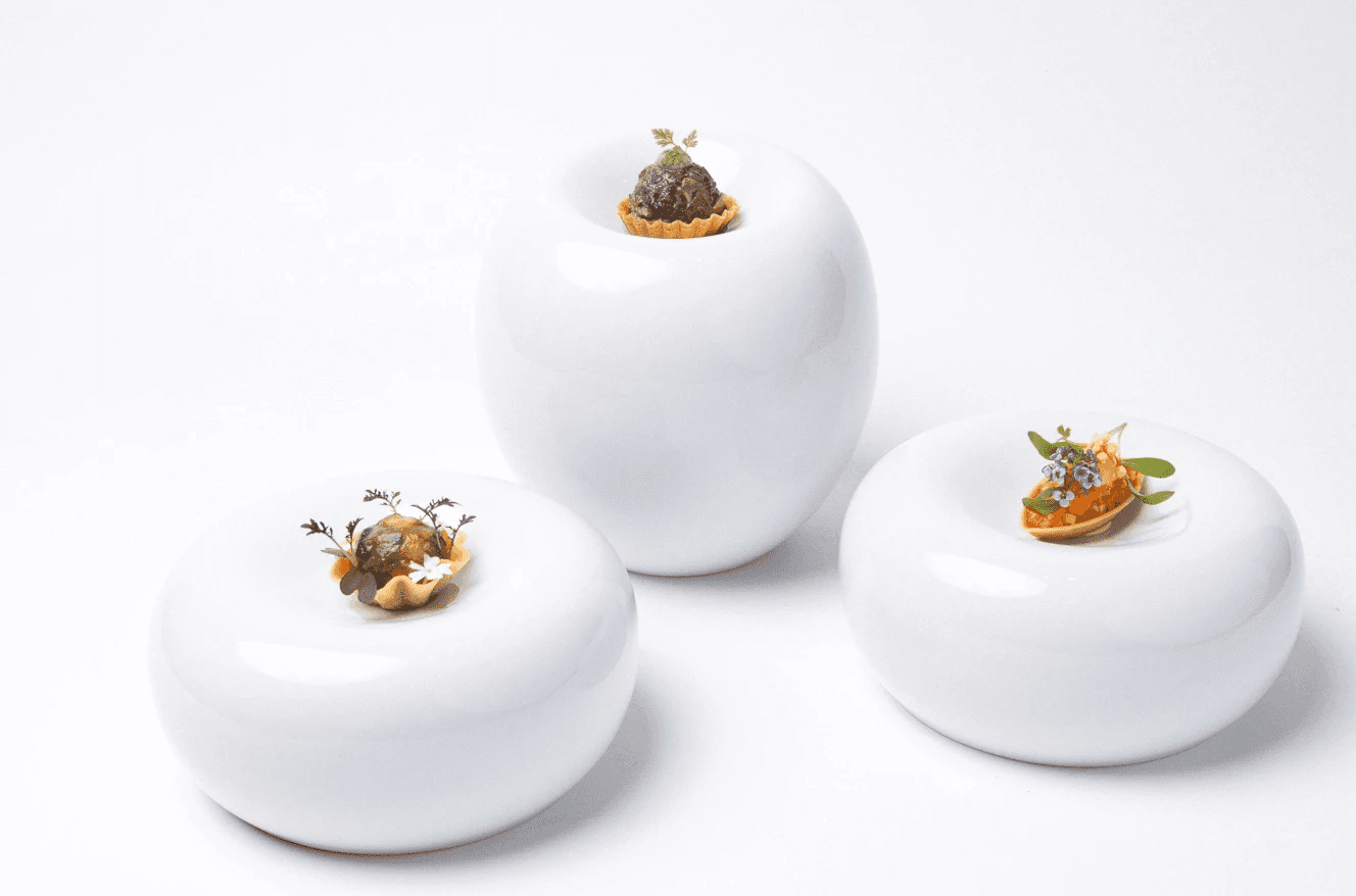 Group of dishes on white background at Mandai Rainforest Resort by Banyan Tree, Singapore, for Forage Singapore