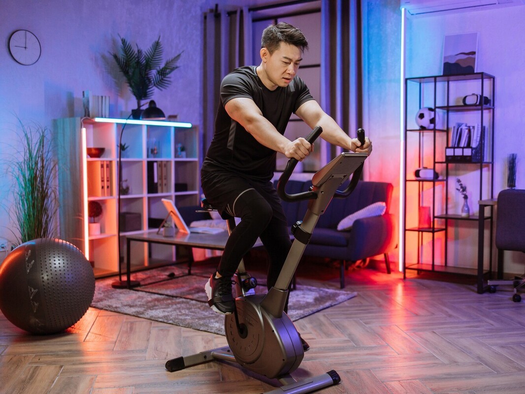 man doing interval training as part of his bike riding weight loss plan