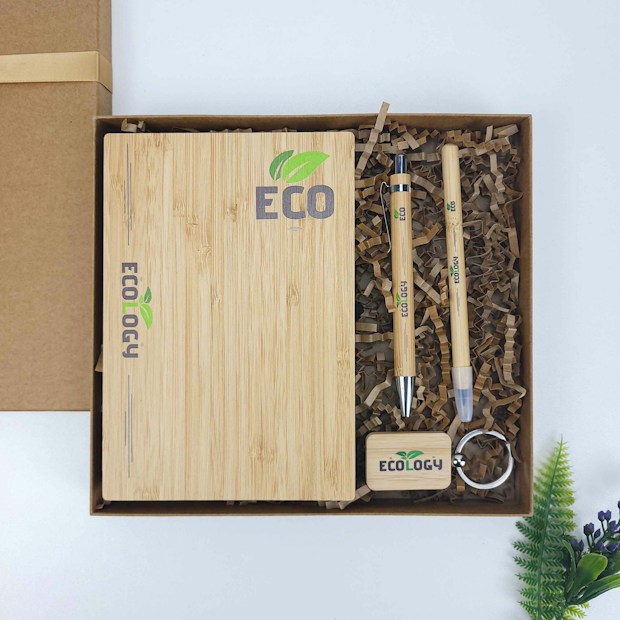 Corporate gift set with a notebook, pens, and keychain in a presentation box