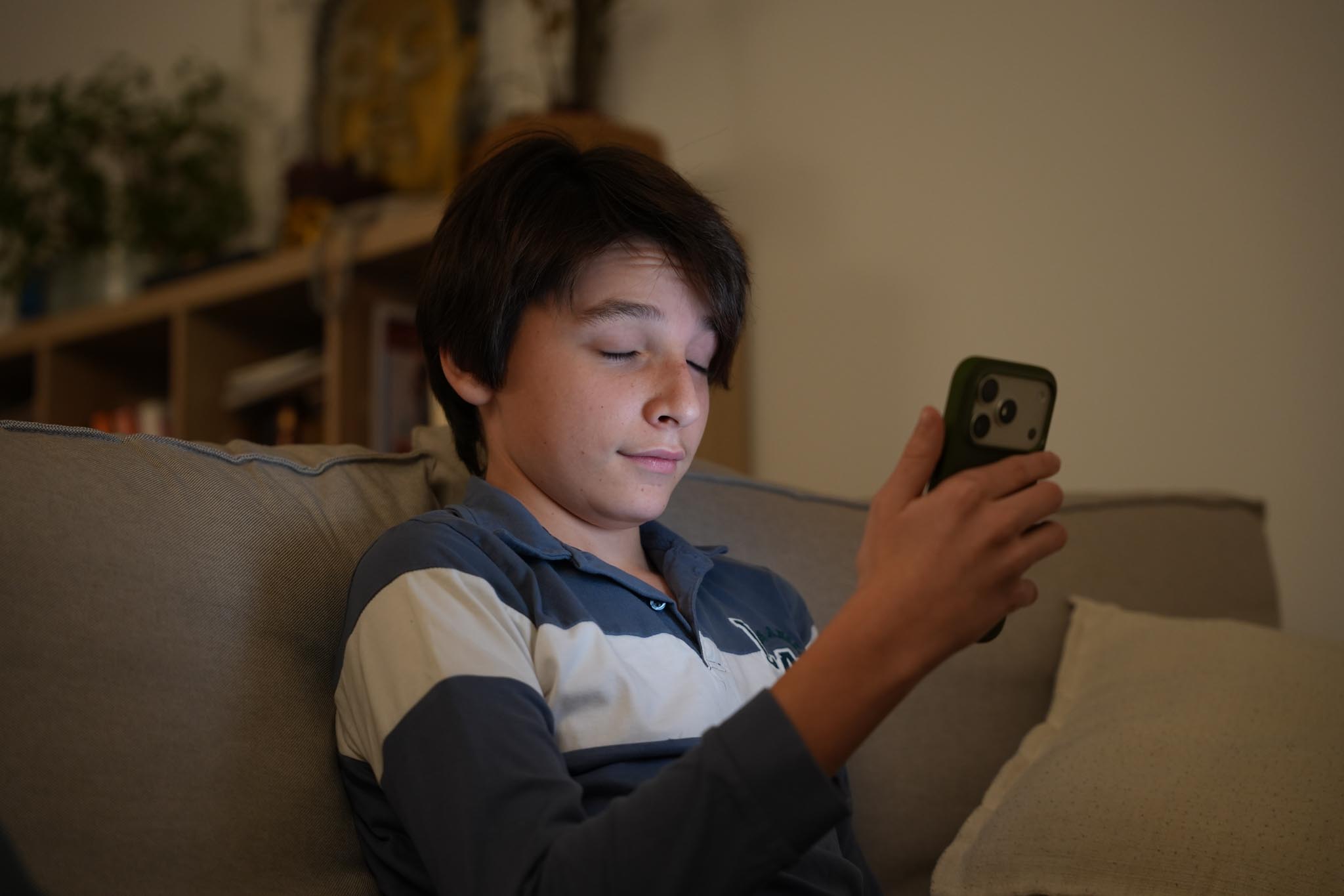 man filming on beach