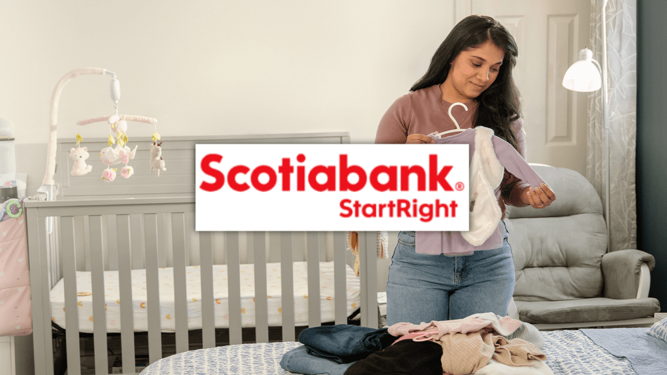A newcomer mother holding baby clothes next to a nursery crib, overlaid with the Scotiabank StartRight banking program logo for Canadian immigrants.