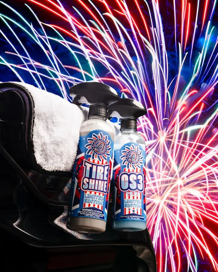 Adam's Polishes limited edition USA Tire Shine and CS3 spray bottles with patriotic label design against a fireworks background — packaging design by Slow Knife Design