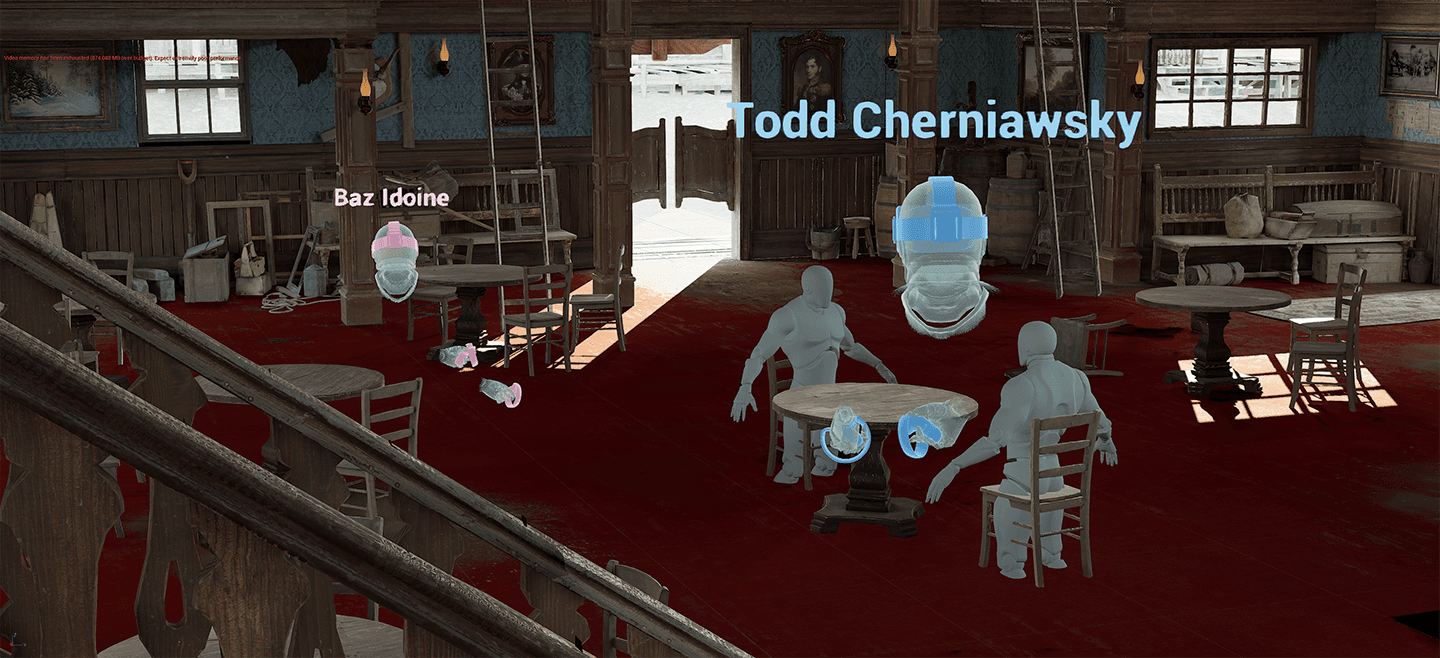 Baz moving tables and chairs in the virtual saloon while Todd looks on.